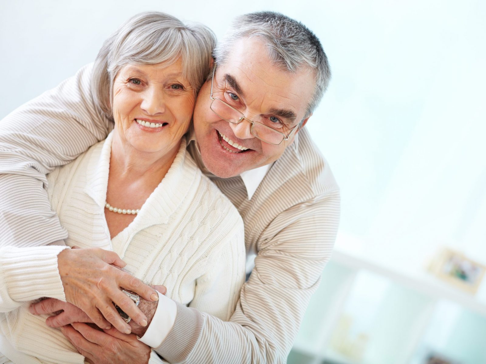Portrait of a happy senior couple looking at camera